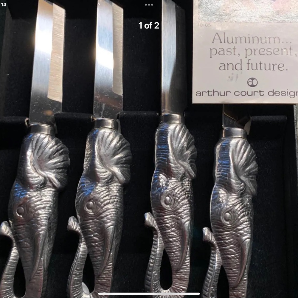 Very unusual steak knives in their original box with tags.